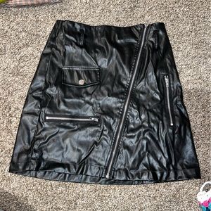 Black pleather mini skirt with silver accessories